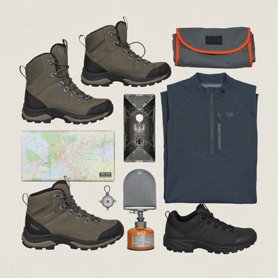 Flat lay of essential hiking gear for various conditions, including boots, backpack, and safety items